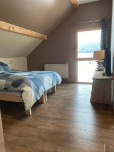 Posteľ alebo postele v izbe v ubytovaní Maison chaleureuse au cœur du massif Jurassien