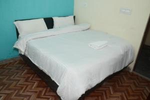 En eller flere senge i et værelse på SPOT ON Hotel Abhinandan