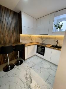 Kuchyň nebo kuchyňský kout v ubytování Magenta Kulina Bana