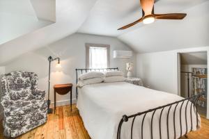 a bedroom with a bed and a ceiling fan at Virginia Retreat with Porch and Grill, Near Beaches! in Wachapreague