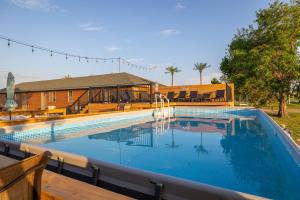 a large swimming pool with a water fountain at The Lodge at Angostura in Hot Springs