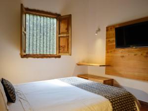 Hotel Hacienda Combia客房内的一张或多张床位