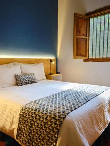 Hotel Hacienda Combia客房内的一张或多张床位