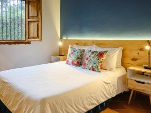 Hotel Hacienda Combia客房内的一张或多张床位