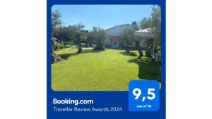 a picture of a yard with a house at TERRY'S VILLA in Makri