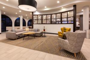 a lobby with couches and chairs and a table at Holiday Inn El Paso West – Sunland Park by IHG in El Paso