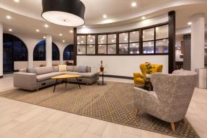 a lobby with couches and chairs and a table at Holiday Inn El Paso West – Sunland Park, an IHG Hotel in El Paso