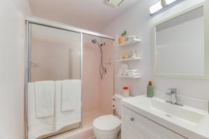 a bathroom with a shower and a toilet and a sink at Convenient Mesa Apartment about 9 Mi to Downtown in Leisure World