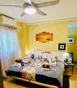 a bedroom with a bed with pillows on it at VINO DE MAYO in Caravaca de la Cruz