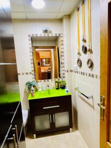 a bathroom with a sink and a mirror at VINO DE MAYO in Caravaca de la Cruz