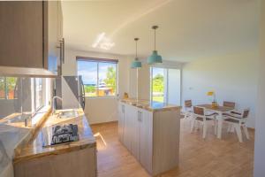 a kitchen and dining room with a table in it at Luxury Eco Apartament in Playa Aguadulce