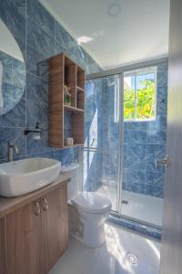 a bathroom with a toilet and a sink and a shower at Luxury Eco Apartament in Playa Aguadulce
