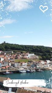 a view of a harbor with boats in the water at Harbour Hideaway, Scarborough. Old Town in Scarborough