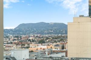 a view of a city with a mountain in the background at NEW 1BR Luxury Highrise in Los Angeles