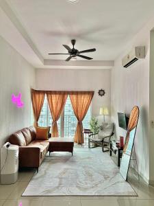 a living room with a couch and a ceiling fan at Nawwarah Homes @ Southville City (WiFi + NETFLIX) in Kajang