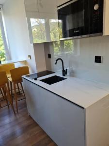 a kitchen with a sink and a counter top at Heart of Sarajevo - Baščaršija Private Garage in Sarajevo