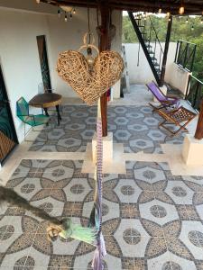 a sculpture of a bird on a floor in a room at Casa Delfín Tulum in Macario Gomez