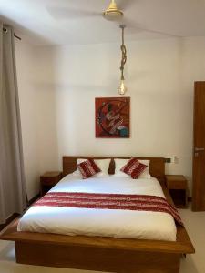 Letto o letti in una camera di Oxygen Paje Hotel