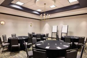 a room with round tables and chairs in it at Renaissance Phoenix Glendale Hotel & Spa in Glendale