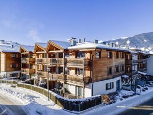 an apartment building in the winter with snow at Mountainview in Kaprun