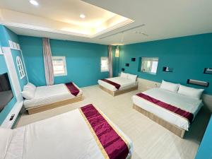 Postel nebo postele na pokoji v ubytování 安可的家 小孩及寵物免費 恆春老街夜市 屏東縣民宿0497