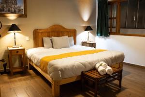 Postel nebo postele na pokoji v ubytování Hotel Casa del Fraile
