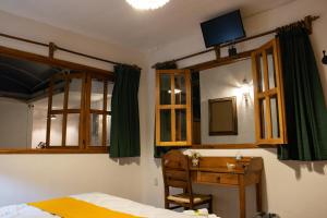 Postel nebo postele na pokoji v ubytování Hotel Casa del Fraile