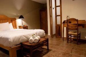 Postel nebo postele na pokoji v ubytování Hotel Casa del Fraile