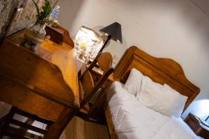 Postel nebo postele na pokoji v ubytování Hotel Casa del Fraile