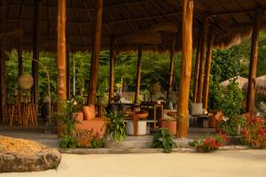 a pavilion with a bunch of plants in it at Menjaga Bay in Labuan Bajo