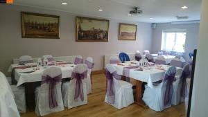 a dining room table set up for a party at Brambletye Hotel in Forest Row