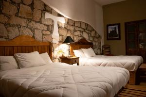 Postel nebo postele na pokoji v ubytování Hotel Casa del Fraile