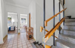 a hallway with a staircase in a house at Lovely Home In Zaton With Wifi in Zaton +19 photos