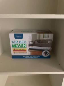 an air bed in a box on a shelf at H-Town Luxury w/ Pool in Houston