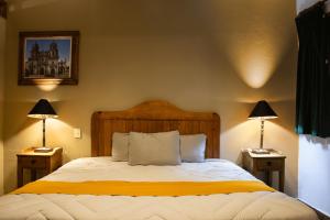 Postel nebo postele na pokoji v ubytování Hotel Casa del Fraile