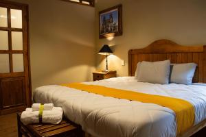 Postel nebo postele na pokoji v ubytování Hotel Casa del Fraile