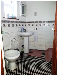a bathroom with a toilet and a sink at Private Annex, Little Flat, Private Entrance in Nottingham