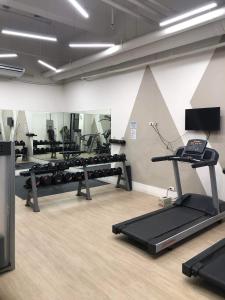 a gym with several treadmills and a treadmill at 3 Beds Filinvest Alabang in Manila