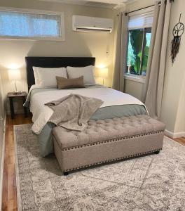 a bedroom with a bed with a blanket on it at Avenue of the Giants Caraway Cottage (#3) 