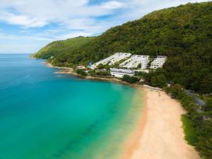 an aerial view of a beach next to a mountain at The Nai Harn in Nai Harn Beach