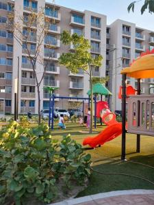 a playground with a slide in a park at apartamento en santa marta in Nuevo Amanecer