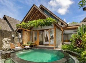 a pool in the backyard of a villa at Wana Bucu Villas by Pramana Villas in Ubud