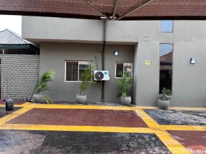 a room with a speaker on the side of a building at Crest Suite and Lifestyle in Owerri
