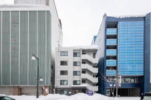 a group of buildings in a city with snow at ASTORIA【2min from Asahikawa sta】 in Asahikawa +21 photos