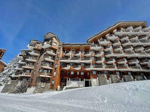 a building in the snow with snow covered at Appartement Avoriaz, 5 pièces, 8 personnes - FR-1-314-241 in Morzine