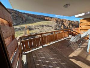a wooden balcony with a view of a mountain at Appartement Vars, 2 pièces, 6 personnes - FR-1-773-19 in Vars