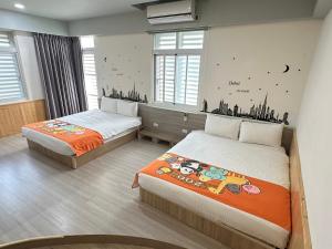 Postel nebo postele na pokoji v ubytování 安可的家 小孩及寵物免費 恆春老街夜市 屏東縣民宿0497