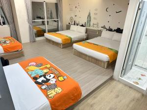 Postel nebo postele na pokoji v ubytování 安可的家 小孩及寵物免費 恆春老街夜市 屏東縣民宿0497