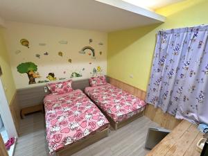 Postel nebo postele na pokoji v ubytování 安可的家 小孩及寵物免費 恆春老街夜市 屏東縣民宿0497