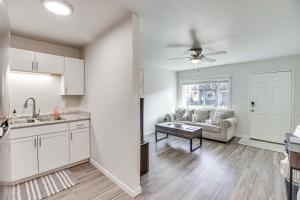 a kitchen and living room with a couch and a table at Grand Junction Vacation Rental Near University! in Grand Junction